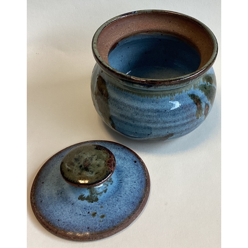 579 - SARAH JANE LANDER (British): A small blue glazed lidded stoneware pot with blue glazed interior. Imp... 