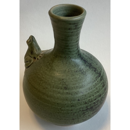 581 - A small celadon stoneware bud vase with tree frog to side. Approx. 13 cms high. Marked 'H' to base. ... 