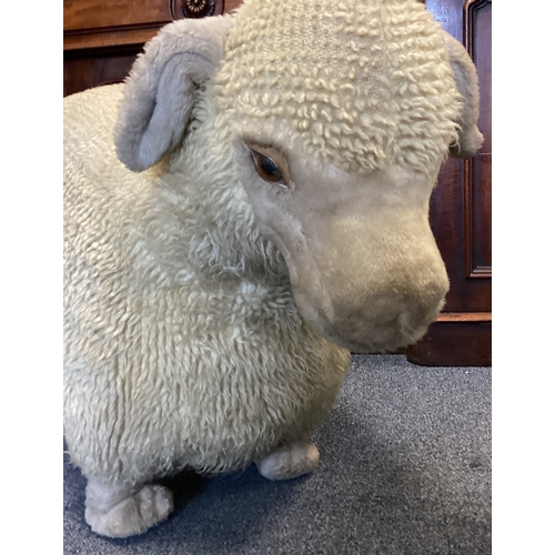 9A - A large woolly sheep footstool nicknamed 'Nigel'. Approx. 55 cms high. Est. £20 - £30.