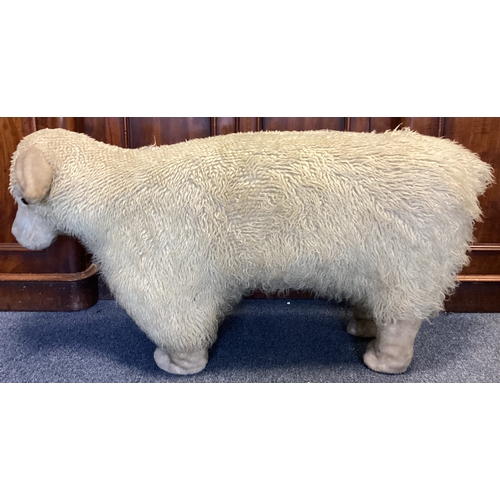 9A - A large woolly sheep footstool nicknamed 'Nigel'. Approx. 55 cms high. Est. £20 - £30.