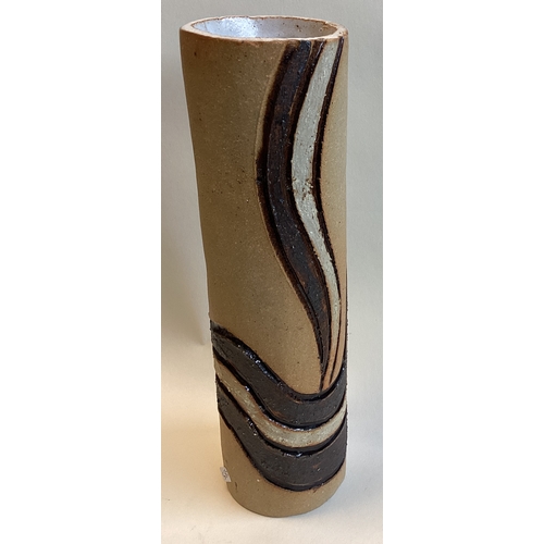 585 - A tall stoneware vase with retro style impressed glazed decoration. Impressed mark 'g' to base. Appr... 