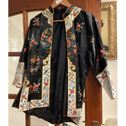 542 - An old silk dressing gown together with another example. Est. £10 - £20.