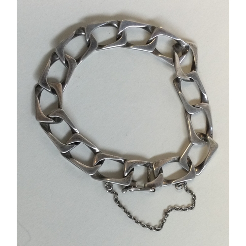 209A - A silver curb link bracelet together with a silver horseshoe brooch with charms. Est. £20 -£30.