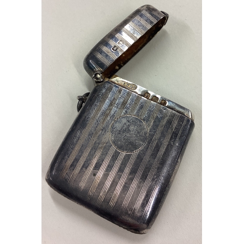 100 - An engine turned silver vesta case. Birmingham 1918. By GFW&S. Approx. 27 grams. Est. £30 - £40.