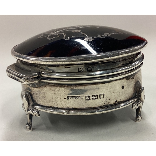 124 - A silver and tortoiseshell jewellery box on feet with hinged lid. Birmingham 1921. Approx. 84 grams ... 