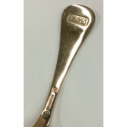 127 - GEORG JENSEN: A cased silver gilt and enamelled spoon with floral decoration. Approx. 45 grams. Est.... 