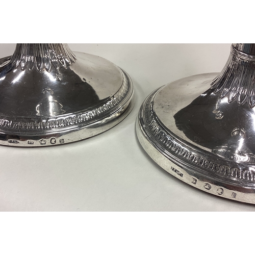 129 - A fine pair of 18th Century George III silver candlesticks. Sheffield 1782. By John Parsons & Co. Ap... 