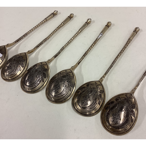 131 - A set of six 19th Century Russian silver gilt spoons with engraved floral decoration. 1890. Approx. ... 