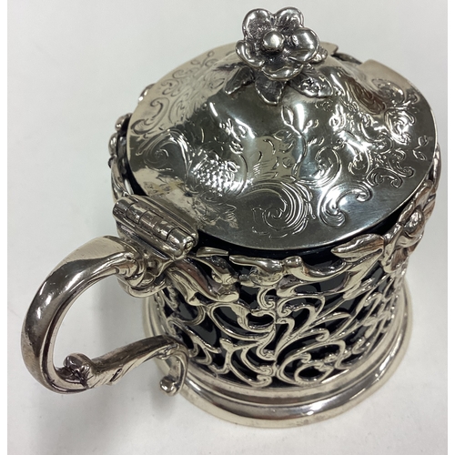 138 - A decorative pierced Victorian silver mustard pot cast with flower finial and BGL. London 1841. By J... 