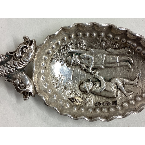 142 - A good quality Continental silver caddy spoon with scroll decoration. Approx. 27 grams. Est. £30 - £... 