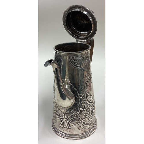 15 - A large 18th Century silver coffee pot with chased decoration. Circa 1720. Approx. 524 grams. Est. £... 