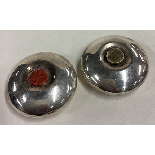 171 - An Art Deco Danish silver salt and pepper set. Marked Sterling. Approx. 43 grams. Est. £40 - £60.