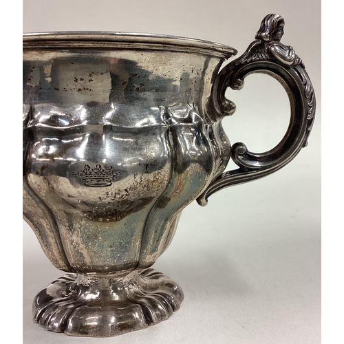 181 - A 19th Century silver mug with figural handle. Approx. 54 grams. Est. £80 - £120.