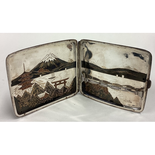 201 - A Japanese Sterling silver and Niello cigarette case. Approx. 76 grams. Est. £60 - £80.