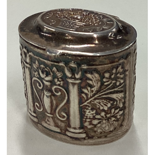 21 - A silver pill box with hinged lid decorated with basket of flowers. Approx. 15 grams. Est. £20 - £30... 