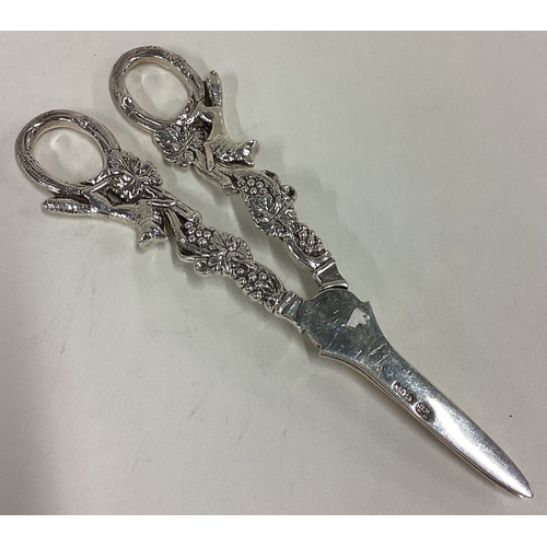 217 - A fine pair of silver grape scissors cast with fox and vine decoration. Sheffield 1939. Approx. 122 ... 