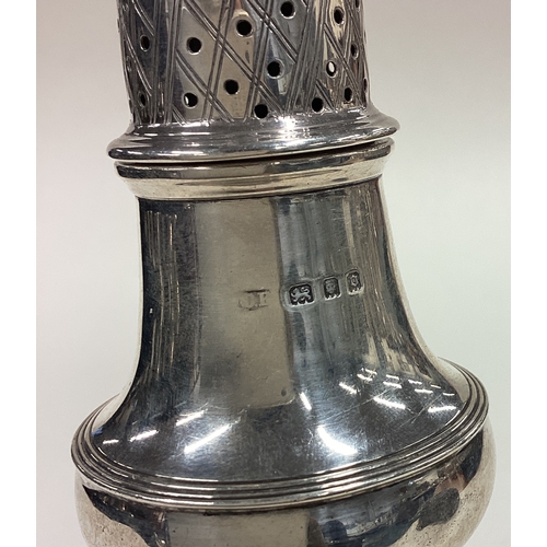 240 - A silver sugar caster on square foot in the Georgian style. Approx. 88 grams. Est. £60 - £80.