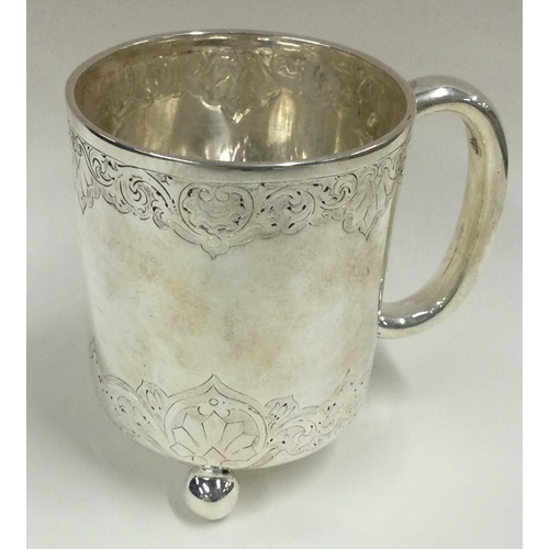 247 - A Victorian silver christening cup on ball feet with engraved decoration. London 1873. Approx. 154 g... 