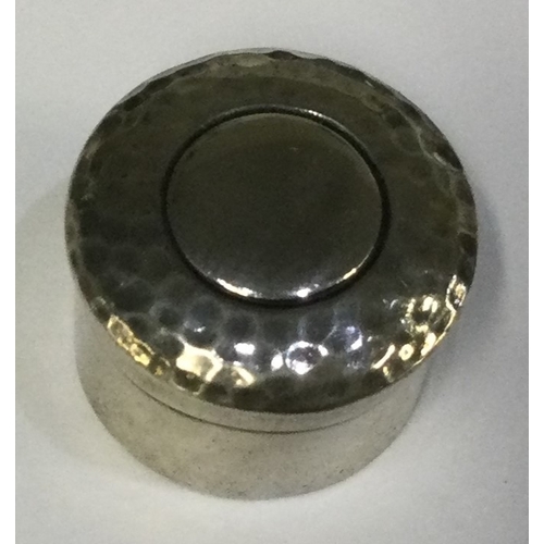 261 - CHESTER: An Edwardian silver pill box with hinged lid and hammered decoration. 1904. By CSFS. Approx... 