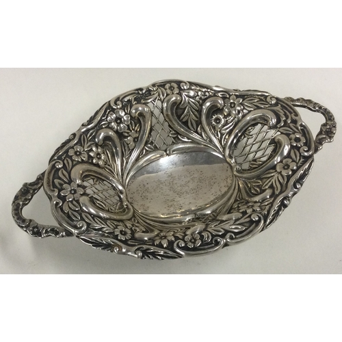 284 - A pierced silver basket embossed with flowers. Birmingham 1898. Approx. 13 grams. Est. £40 - £60.