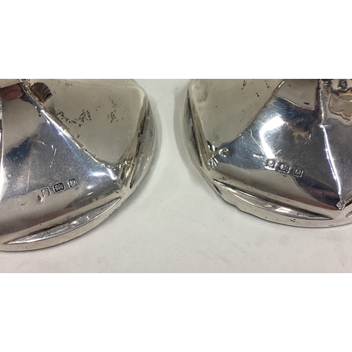 294 - A tall pair of shaped silver candlesticks. Birmingham. Approx. 388 grams of gross weight. Est. £30 -... 