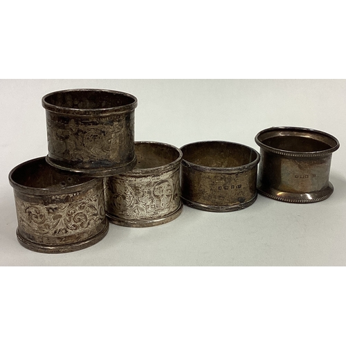 3 - A set of five heavy silver napkin rings. Various dates and makers. Approx. 101 grams. Est. £20 - £30... 