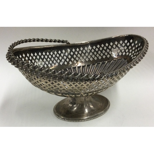 318 - A fine Victorian silver swing handled basket with pierced decoration. Birmingham 1867. Approx. 269 g... 