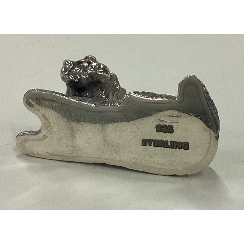 32 - A Sterling silver figure of a dog. Approx. 12 grams. Est. £30 - £40.