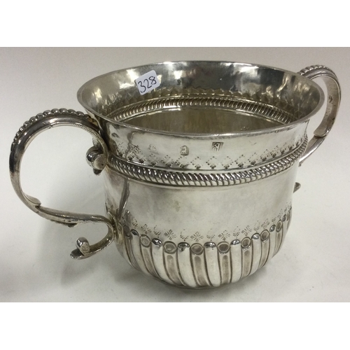 328 - A large Queen Anne silver porringer. Fully marked to body. London 1704. Probably by Samuel Bates? Ap... 