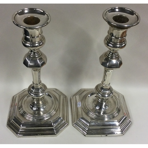 329 - A fine pair of octagonal silver candlesticks in the Georgian style. London 1912. By Thomas Bradbury ... 