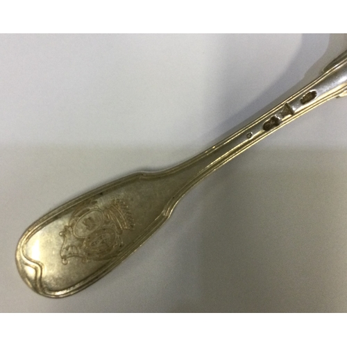 330 - An 18th Century French silver tablespoon with central armorial. Approx. 83 grams. Est. £80 - £120.