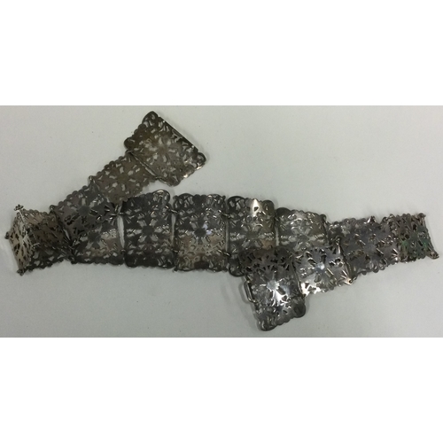 340 - A large silver belt with pierced decoration. Birmingham 1911. By SML. Approx. 155 grams. Est. £120 -... 