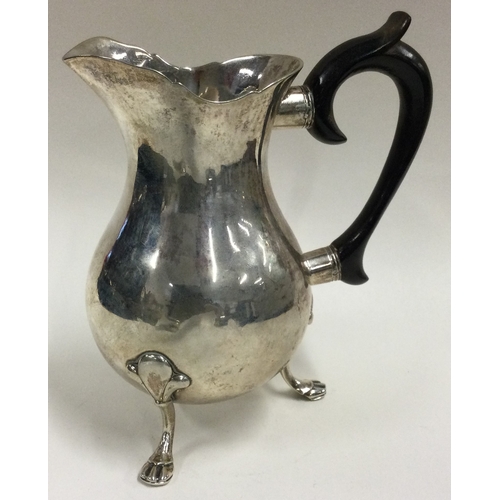 342 - An 18th / 19th Century silver jug. Marked to base. Approx. 238 grams. Est. £200 - £300.