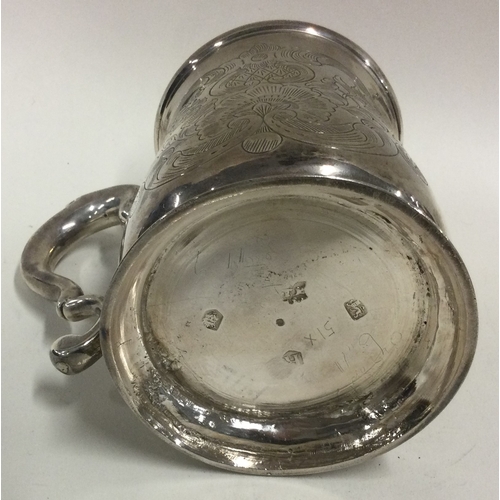 344 - An early George II silver mug engraved with floral decoration. 1732. By Thomas Mason. Approx. 190 gr... 