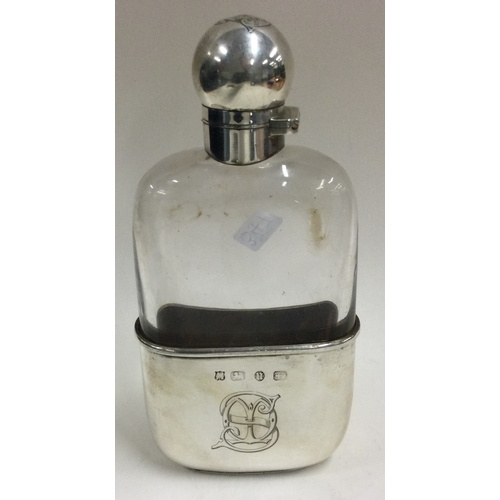 347 - A heavy Victorian silver and glass flask with screw-top lid and detachable silver cover. Fully marke... 