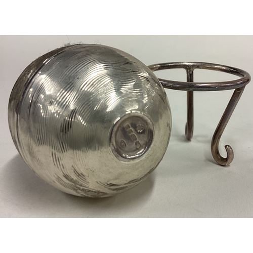 381 - A silver surprise egg with stand. London 2000. Approx. 116 grams. Est. £120 - £150.