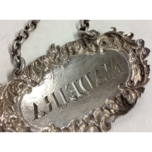 386 - A plain silver wine label for 'Madeira' on suspension chain. London. Approx. 22 grams. Est. £30 - £5... 