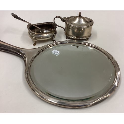 4 - A small silver mustard pot, salt, mirror etc. Est. £20 - £30.