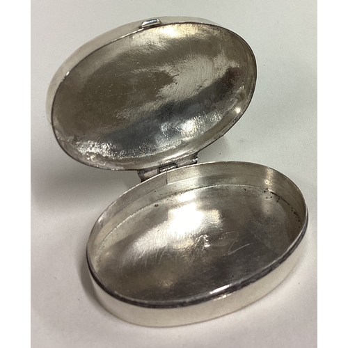 401 - An engraved silver pill box with hinged lid. Marked to interior. Approx. 14 grams. Est. £20 - £30.