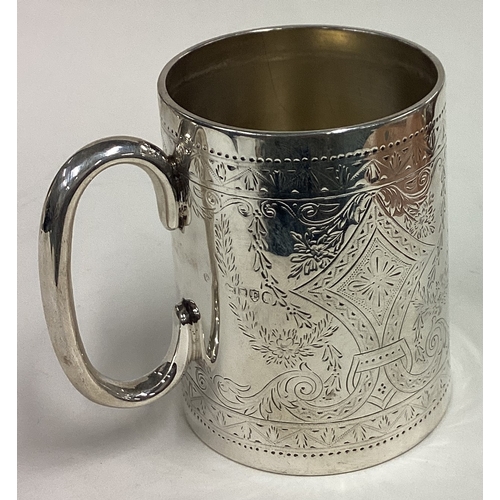 415 - A Victorian silver christening mug with engraved decoration. London 1880. Approx. 152 grams. Est. £1... 