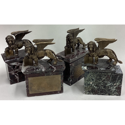 420 - A set of four bronze 'Cannes Festival' griffin figures. 1971. Est. £100 - £150.