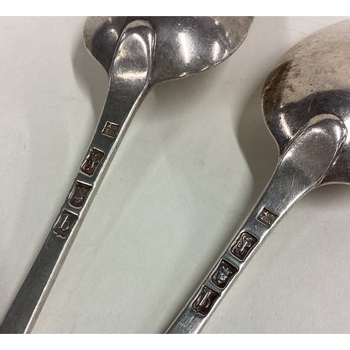 424 - A pair of 18th Century George III silver basting spoons. London 1777. By William Eley I & George Pie... 