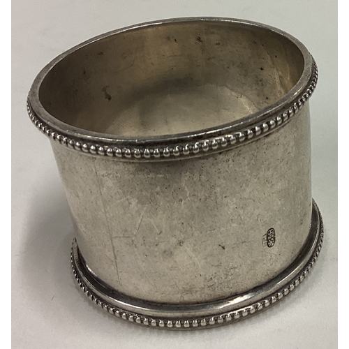 430 - A heavy Russian silver napkin ring with beaded decoration. Marked 84. Approx. 50 grams. Est. £50 - £... 