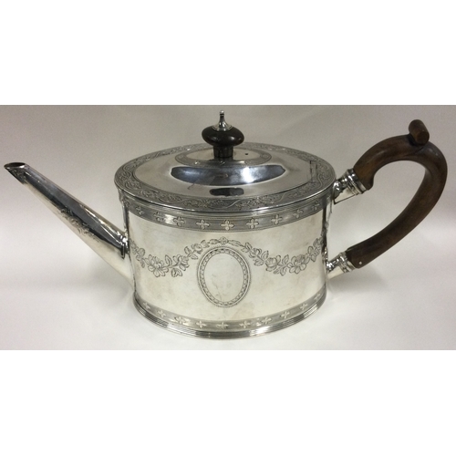 439 - An 18th Century George III silver teapot with bright-cut decoration. Fully marked to base and lion m... 