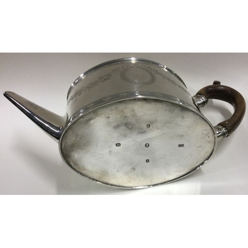 439 - An 18th Century George III silver teapot with bright-cut decoration. Fully marked to base and lion m... 