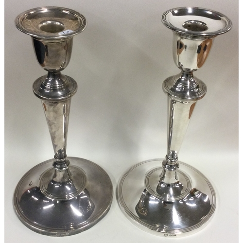 450 - A large pair of silver candlesticks in the Georgian style. Fully marked to rim of bases, part marked... 