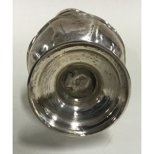 455 - An 18th Century Georgian silver sugar caster. Marked to base. Approx. 95 grams. Est. £80 - £120.