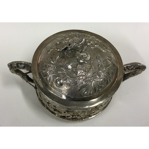 476 - A pierced Chinese silver butter dish with hinged lid. Circa 1880. Approx. 250 grams. Est. £200 - £30... 