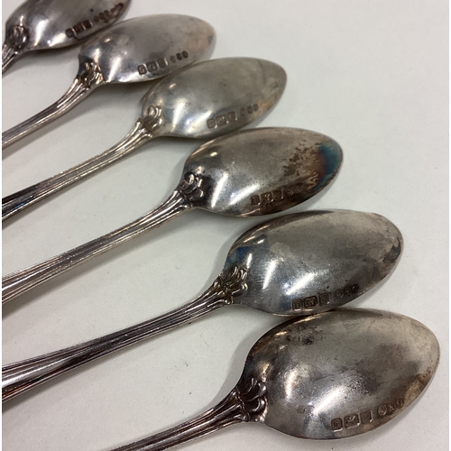 499 - A set of six fancy silver teaspoons. London. By DC. Approx. 86 grams. Est. £30 - £50.