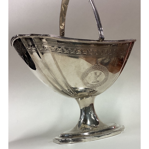 51 - DUBLIN: A large Irish silver swing handled basket with bright-cut decoration. 1795. By William Bond.... 